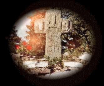 Cross on graveyard wall